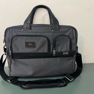 Tumi Gray and Black Briefcase with Adjustable Strap and Durable Material